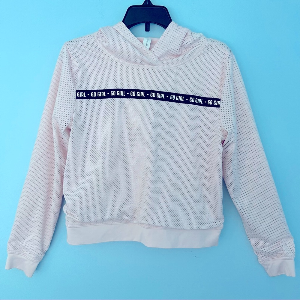 Ideology Long Sleeve Hooded Lined Mesh Top. “Go Girl” repeated across front.